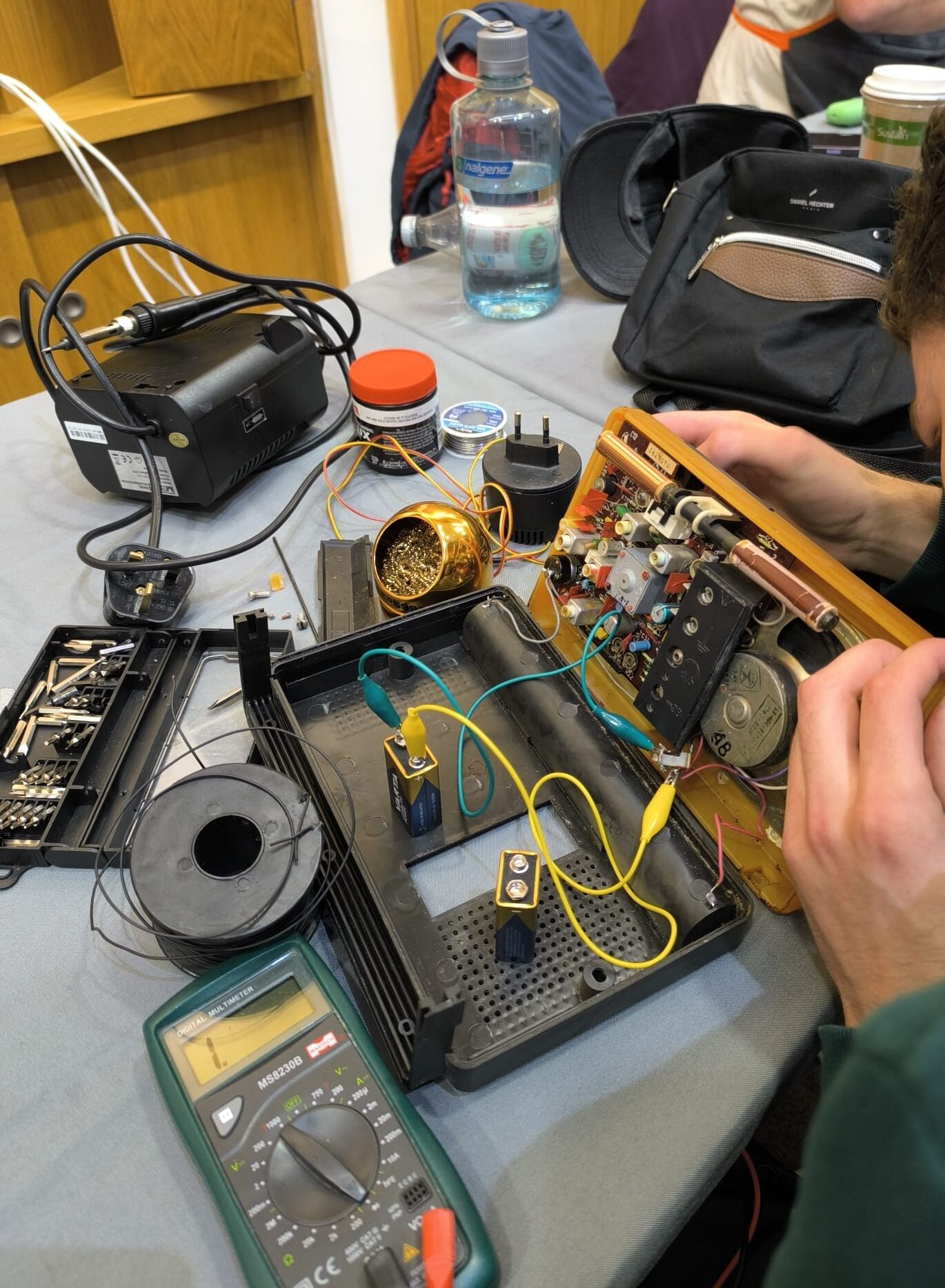 An old radio that's been taken apart.